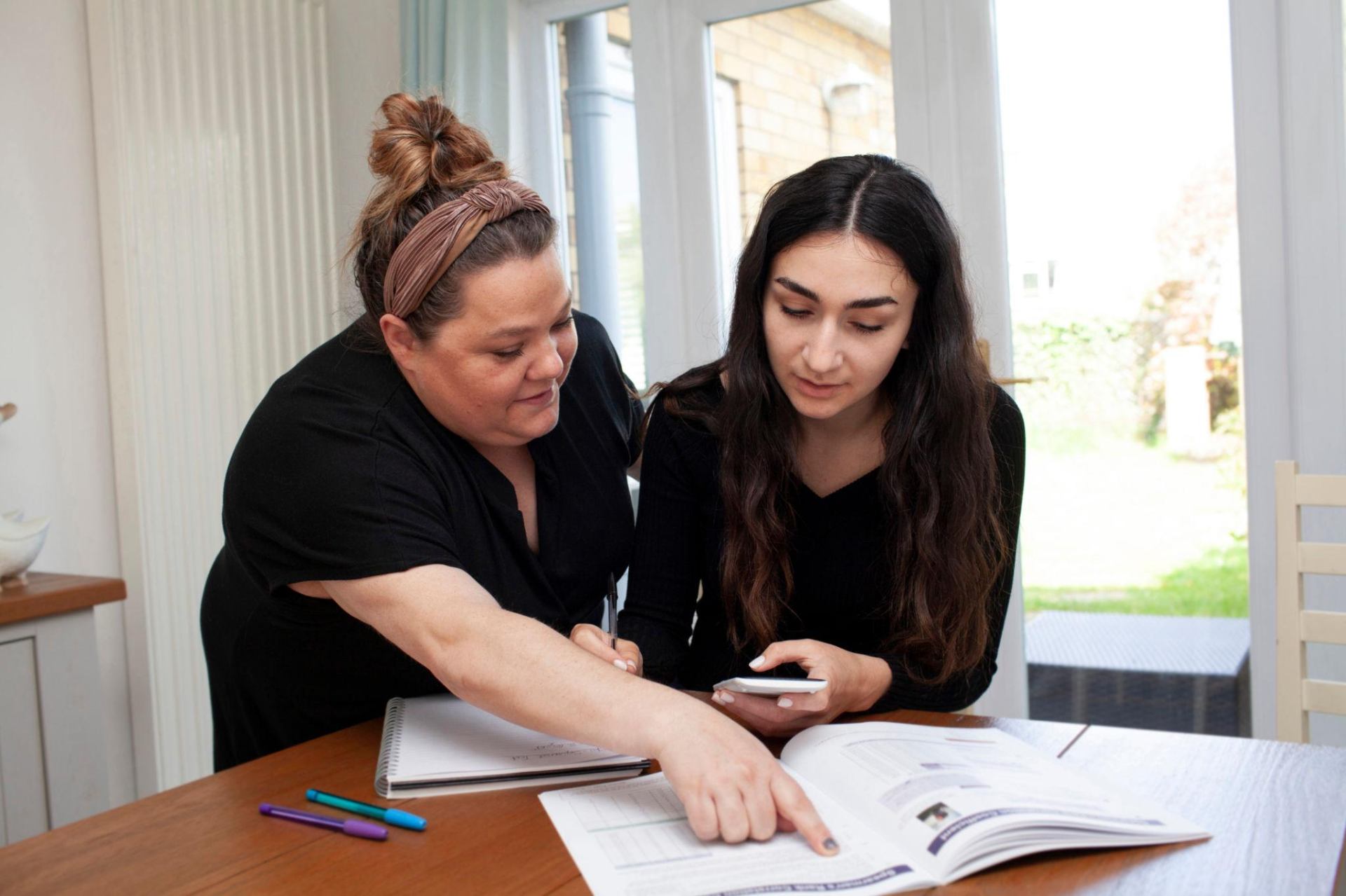 Parent supporting student with GED study